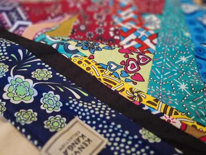 A small label sewn into the corner of a patchwork quilt